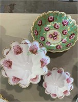 Three antique pink rose decorated bowls - one gold