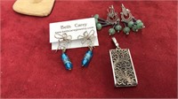 2 pairs of earrings and a pendant