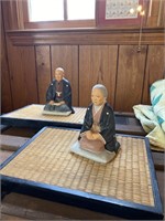 Porcelain Asian figurines on bamboo stand