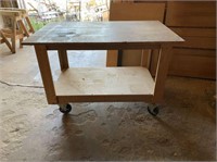 WOOD WORKING TABLE ON CASTERS WITH LOWER SHELF