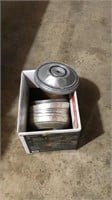 Box of old Chevy hub caps