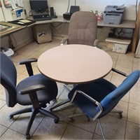 Round commercial table with chairs.