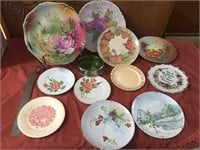 Collection of 11 hand painted plates