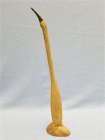 Fossilized whale bone carving of a bird, 17" long