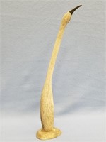 Fossilized whale bone carving of a bird, 16" long