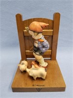 Hummel figurine of a boy and two piglets