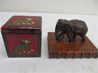 Monkey box & brass elephant on book