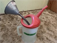 Oil jug with a small funnel