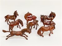 Set of 9 carved wooden horses. Very detailed