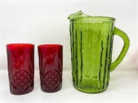 Vintage raised green glass pitcher and two ruby