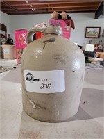 Gray/Tan jug with cork, appears full