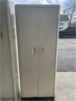 Two door metal cabinet 5’3” tall 24 inches wide