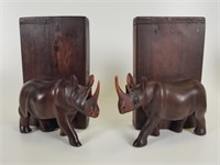 Carved wood rhino bookends