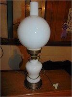 Milk glass and brass lamp