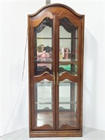 Tall wood & glass lighted curio cabinet