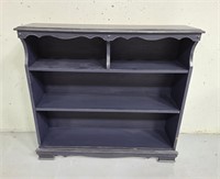 Painted blue wood bookcase shelf