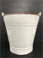 White and red metal enameled bucket