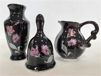 Black ceramic mini vase, bell, and creamer