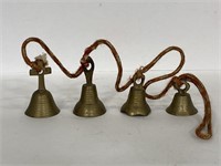 String of vintage brass metal bells