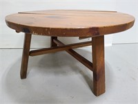 Rustic knotted wood round coffee table