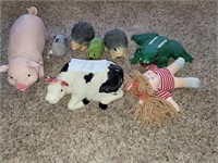 Misc. toys, cow, pig, frog, doll, hedgehog etc