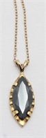 10kt yellow gold chain and pendant containing