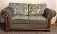 Upholstered love seat with carved wood front 72"