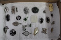 Brooches and pendants including pewter