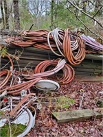 LARGE COLLECTION OF LUMBER AND HOSES