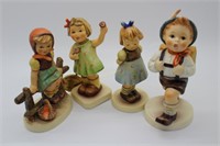 Four Goebel figurines: Two hands, one treat, girl