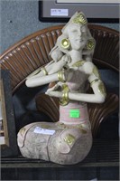 Terra-cotta figure of seated mediating woman
