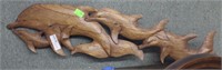 Hand carved  school of dolphins