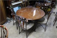 Wrought iron based round dining table with 4