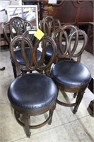 Set of four round seated oval backed bar stools