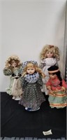 Four porcelain dolls