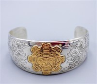 STERLING AND 14KT GOLD WRIST BANGLE BY JOE WILSON