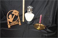 Paper holder, brass candlestick, and dog statue