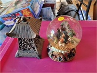 snow globe and cast iron candle holder