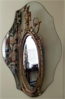 Shapely frameless bevelled mirror