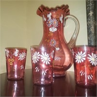 Cranberry glass pitcher w 3 glasses
