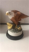 The American Bald Eagle figurine with wood base.
