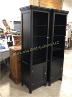Tall, narrow black lighted curio cabinet