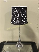 Glass candlestick style lamp with black Shade