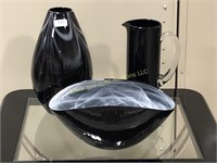 Trio of black glass decorative items