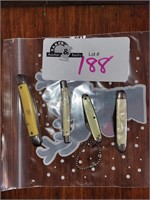 lot of 4 knives, 2 pearl handled, 2 yellow
