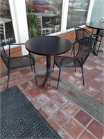 pedestal table with 2 patio chairs