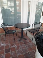 pedestal table with 2 patio chairs