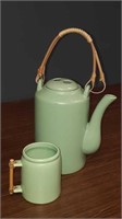 Green Asian teapot with one cup handle needs a