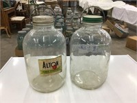 Two vintage gallon jars with handles