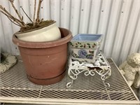 3 pant potters and small white stand